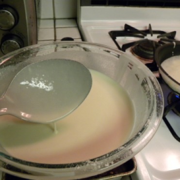 Use a serving size spoon to pour crepe mixture into pan.